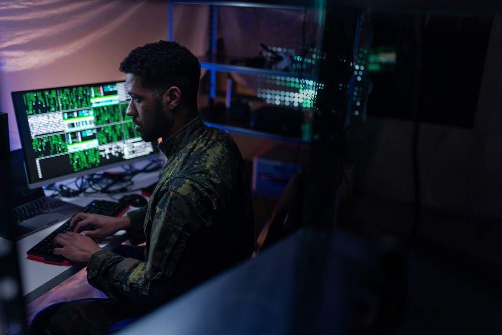 Cyber security professional sitting on computer